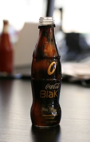 someone drinking coke blak